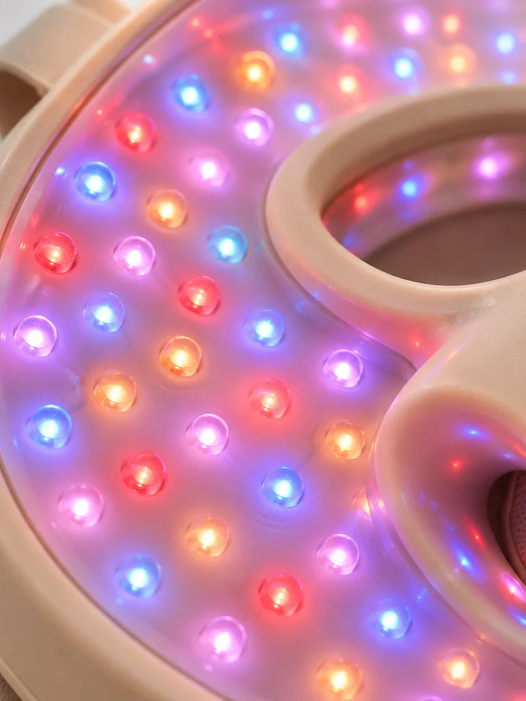 An extreme macro photograph of the exact beige mask’s inner LED panel, the real molded silicone surf